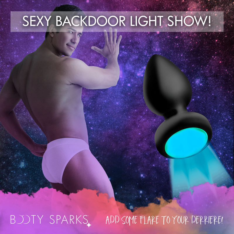 Booty Sparks 7X light up anal plug, medium: black silicone vibrating plug with a glowing LED base
