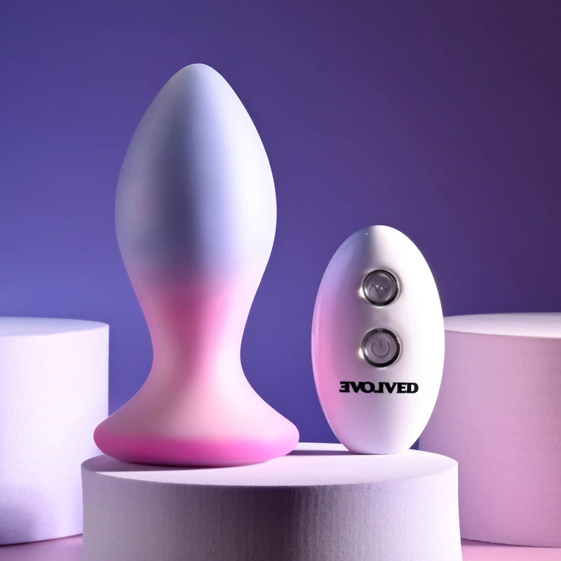 Evolved Paradise Plug and Remote: lavender and pink ombre silicone vibrating butt plug with a white Evolved remote