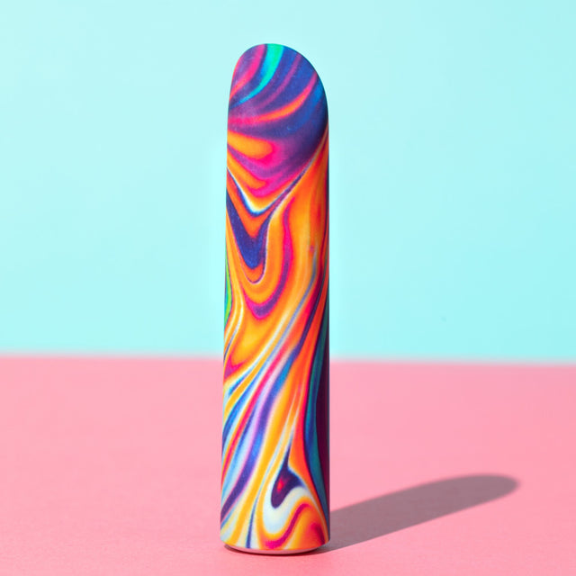 Blush Limited Addiction Psyche: rechargeable bullet vibrator with a rainbow psychedelic swirl finish and angled tip