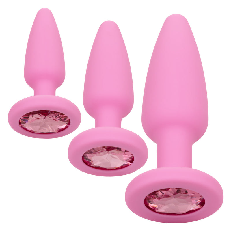 CalExotics First Time Crystal Booty Kit in pink: three silicone anal plugs in graduated sizes with pink gem bases