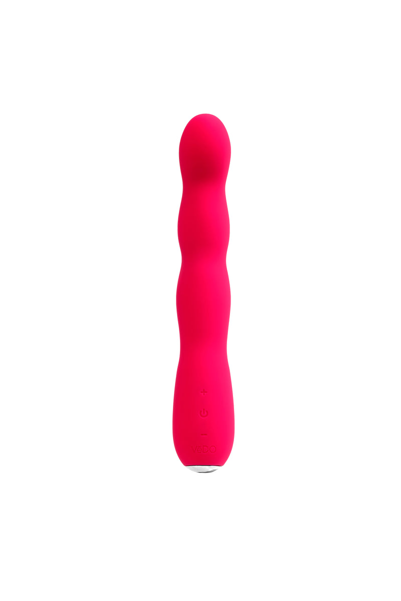 VeDO Quiver Plus in Foxy Pink: slim wavy silicone vibrator with a rounded tip, front view