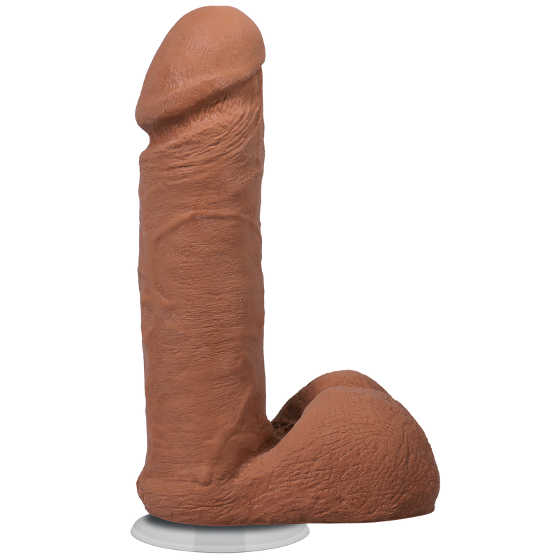 Doc Johnson The Realistic Cock 6 in: realistic dildo in a medium brown skin tone with balls and a suction cup base, side view