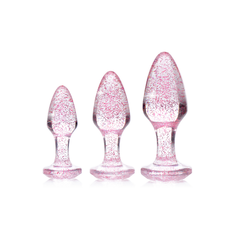 Booty Sparks Glitter anal plug set in pink: three clear plugs with pink glitter in small, medium and large