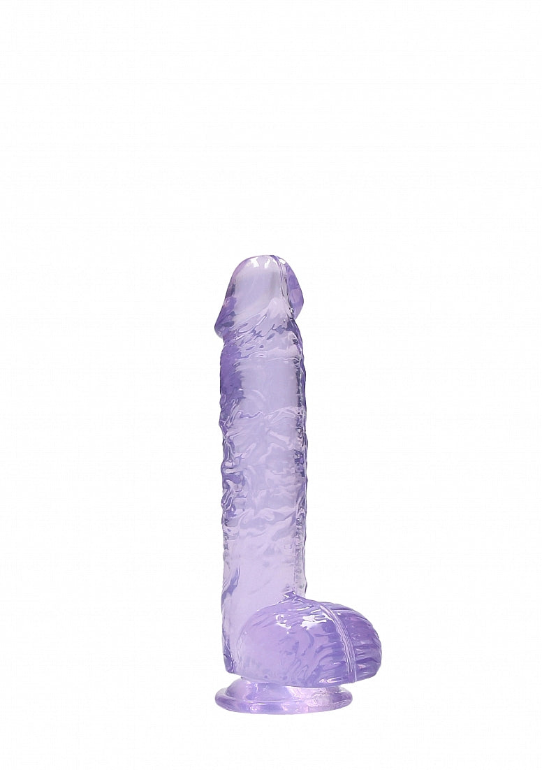 RealRock 6 inch dildo in purple: clear purple realistic veined dildo with balls and a suction cup, side view