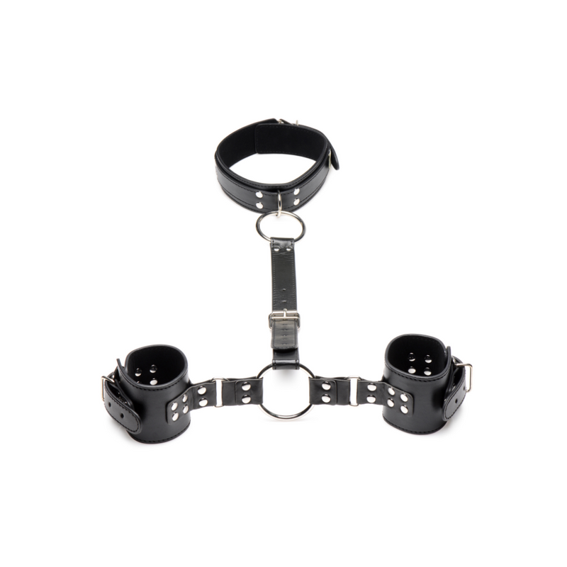 Strict neck to wrist cuffs: black vegan leather collar joined by a buckled strap and O-ring to two wrist cuffs