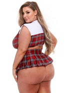 Back view of the queen size red plaid crop top and pleated mini skirt on a model