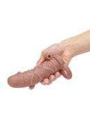 Tan Size Up extender held in one hand to show its length and ball loop