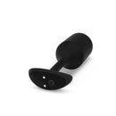 Close-up of the Vibrating Snug Plug 4 base with the power button and charging contacts
