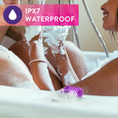 IPX7 waterproof: purple Pleasure Ring resting on the edge of a bubble bath