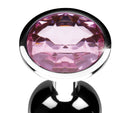 Close-up of the faceted pink jewel on the small plug base