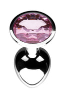 Top view of the pink jewel on the base of the small metal plug