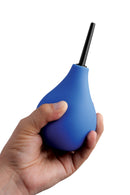 Blue CleanStream douche bulb held in one hand to show its size