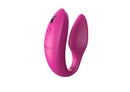 Pink Sync upright and angled, showing the ribbed inner arm and charging port