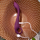 Purple Lochness charging with its USB cable plugged in
