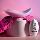 Evolved Paradise Panty and Remote: pink and lavender curved panty vibrator on pink lace panties, with Evolved remote