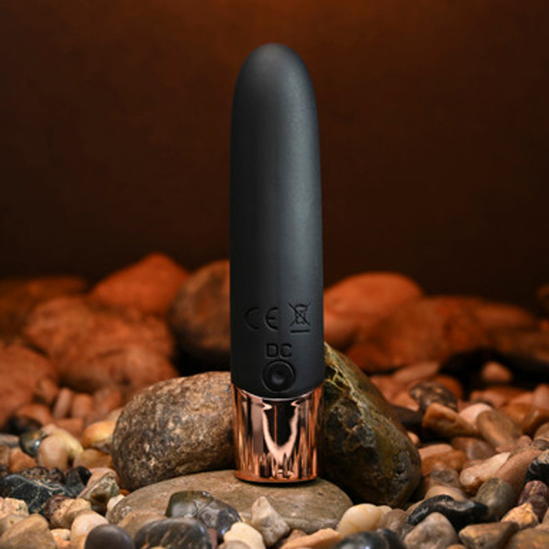Gender X Gold Standard: black silicone lipstick-shaped bullet vibrator with a slanted tip and rose gold base