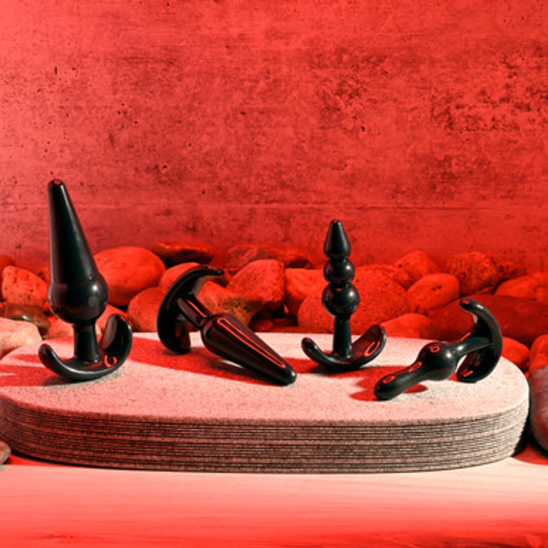 Selopa Intro to Plugs 4 Piece Set: four black anal plugs in different shapes with curved anchor bases