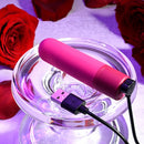 Tiny Temptation with its magnetic USB charging cable attached to the base