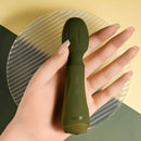 Olive green Heartfelt held in an open hand to show its size