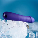 Ambition lying on ice with its USB charging cable plugged into the base