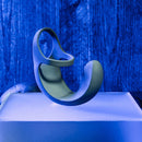 Gray Vibrating Ball Cradle standing on its side, showing the shaft loop and curved cradle