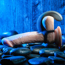 Vibrating Ball Cradle on a realistic display model lying on stones, showing the cradle placement