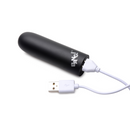 Black Bang! Mega Bullet with its white USB charging cable plugged into the base
