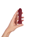 Maroon Booster Bullet held in one hand to show its size