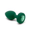 Close-up of the emerald Jewel Plug showing the faceted green gem set in its base