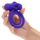 Purple Dual Climaxer held in one hand to show its size