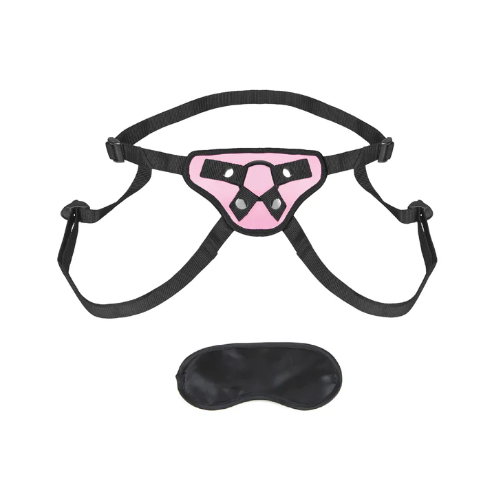 Lux Fetish Strap-On Harness in pink: pink and black adjustable strap-on harness with an O-ring front and a satin blindfold