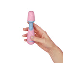 Pink FMix mini wand held in one hand to show its size