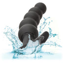 Boundless Vibrating Beaded Plug in a splash of water to show it is waterproof