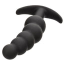 Boundless Vibrating Beaded Plug lying on its side, showing the beads and curved base