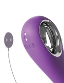 Close-up of the Ultimate Pleasure Pro chrome loop handle with its magnetic charging cable