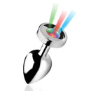 Small metal light up plug with its LED base shining green, red and blue beams
